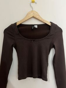 brown top with a small bow