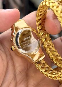 Elegant Gold Watch with Green Dial