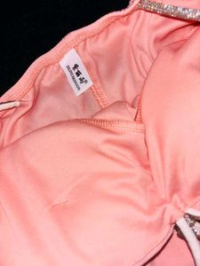 Peach ruched bodycon dress with sparkling ringston