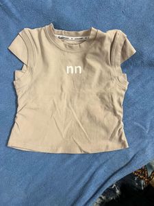 Cute Beige Sleeveless Top with Logo