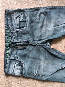 Distressed Blue Denim Jeans