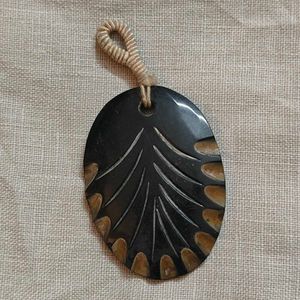 carved bone pendant
