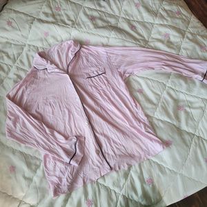 This Victoria's Secret satin pajama top features a