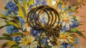 Gold Tone Bangles with Charm Drops 🪭