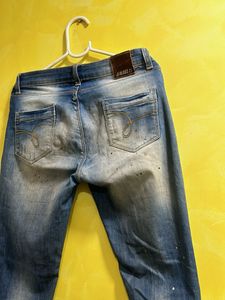 Distressed Blue Jeans with Paint Splatter