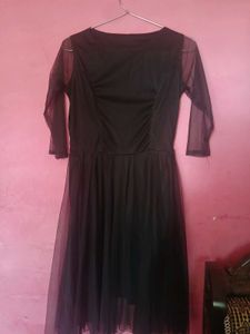 Elegant Black Dress with Sheer Sleeves