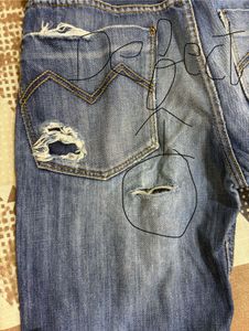 Combo of black shirt and blue straightfit jeans