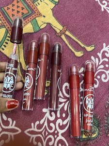 matte liquid lipstick with lip cryon on tip.