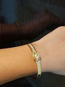 Elegant Gold Tone Bangle Bracelet with CZ Stones
