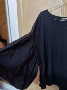 Stylish Black Top with Dramatic Sleeves