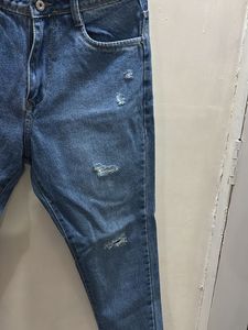 Distressed Blue Denim Jeans