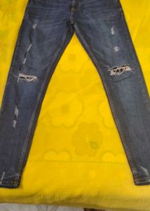 Distressed Blue Denim Jeans
