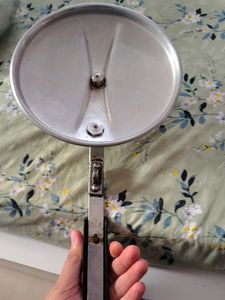 A silver pressure cooker