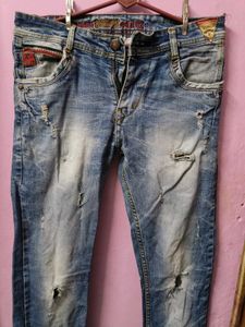 Distressed Blue Denim Jeans