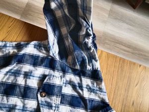 Blue Plaid Button-Up Shirt with ruffled sleeves.