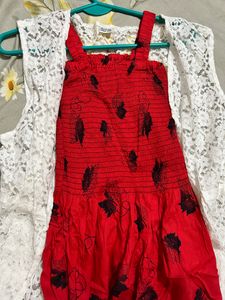 red coloured fit and flare dress with lace shrug