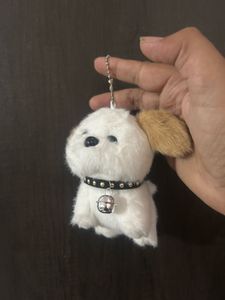 fluffy white puppy plush keychain featuring