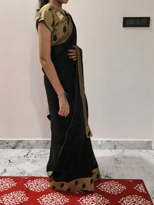 Elegant Black Saree with Gold Border