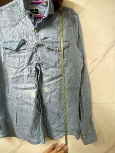 A MILDLY BLUE FADED DENIM SHIRT