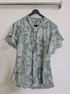 Elegant Green Printed Blouse with Embellished Coll
