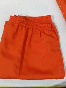 Vibrant Orange Kurti with White Polka Dots