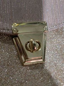 purse in rose Golden colour.