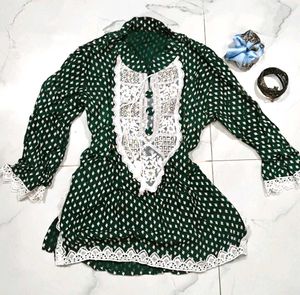 A beautiful dark green short kurti with embellish