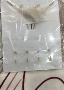 white floral pendant set with 4 pairs of studs