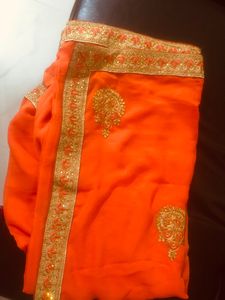 beautiful golden embroidery border orange saree