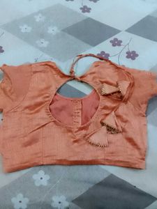 Beautiful Orange Saree with Feather Motifs