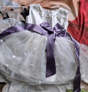Elegant White Baby Dress with Purple Bow