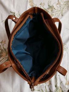 "Carry your essentials in style with this Handbag"