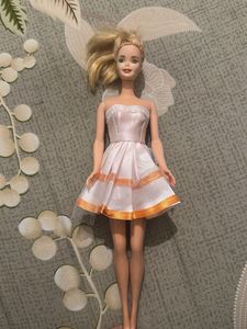 leo Barbie Doll with Pink Dress