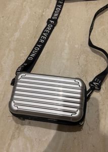 Convertible Silver Mini Luggage Style Clutch.