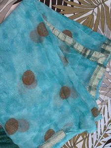 Stunning Teal Blue Saree with Gold Accents