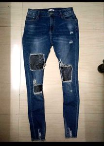 Distressed Ripped Jeans with Fishnet