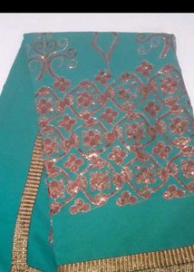 Elegant Teal Saree with Intricate Print