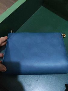 Stylish Blue Handbag with Gold Chain