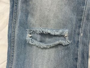 washed out distressed Blue baggy Jeans