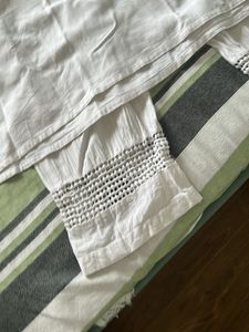 Elegant White Kurta Set with Intricate Detailing