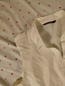 Cream Sleeveless Button-Up Top