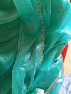 Elegant Teal Saree suitable for parties..