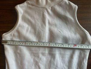 White fitted high-neck sleeveless top