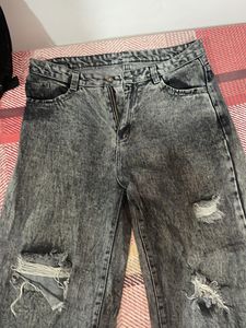 Acid washed distressed black oversized jeans