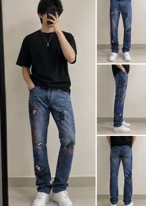 Chrome Hearts cross patch graphic blue jeans