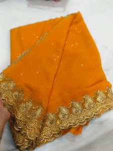 Vibrant Orange Saree with Gold Embroidery