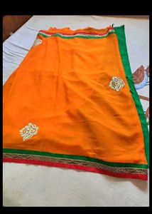 Vibrant Orange Saree with Golden Border