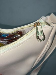 Chic Cream Hobo Bag with Gold Bow Accent