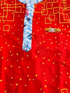 Vibrant Red Boys Polo Shirt with Geometric Print