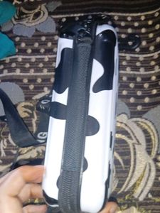 a sling bad in black or white colour